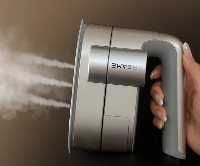 Hand holds, steam on